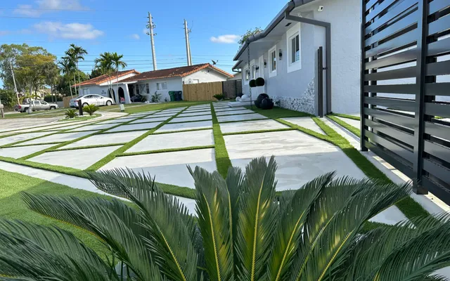 Backyard artificial grass beside a pool installed by Govorex in South Florida