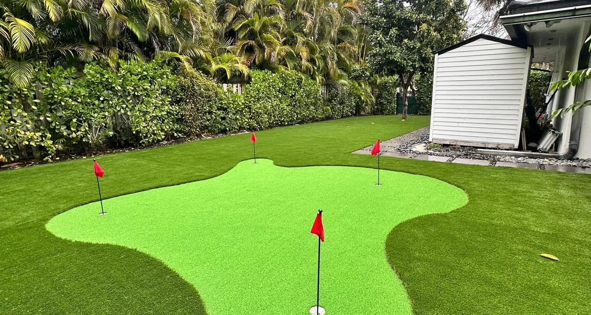 Custom backyard putting green with multiple cups installed by Govorex