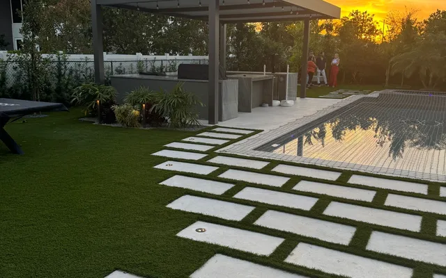 Artificial grass backyard at sunset installed by Govorex